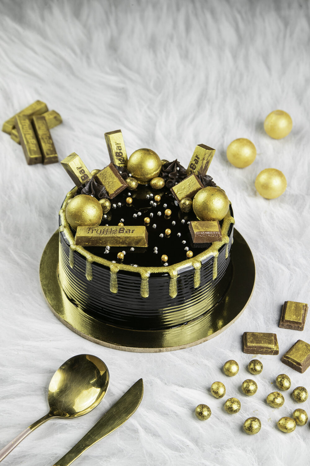 Chocolate celebration cake with gold detailing