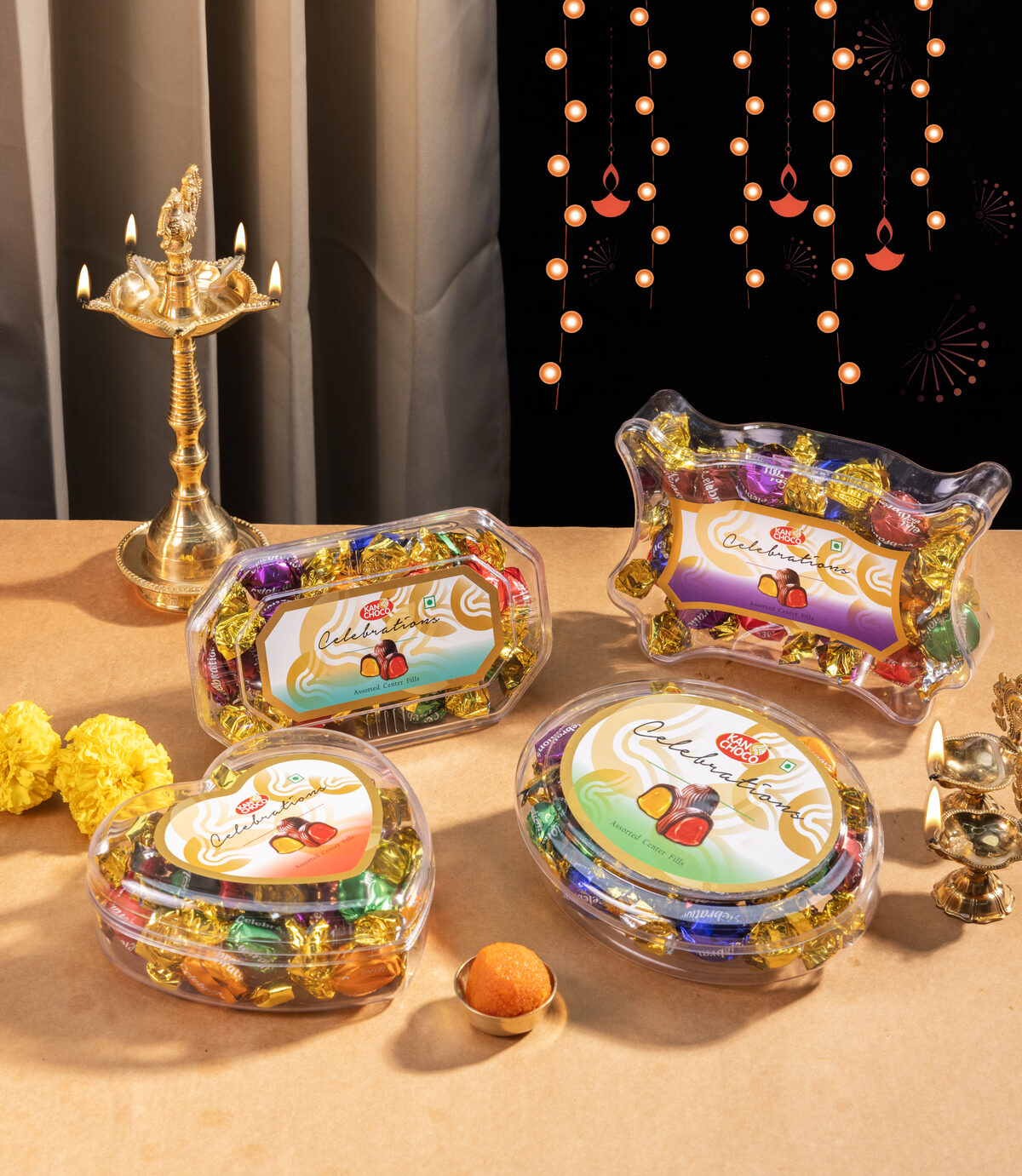 Festive gift assortment styled with a diya